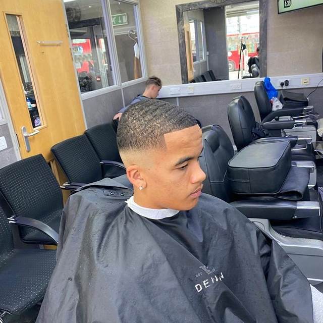 Barber giving a child a haircut